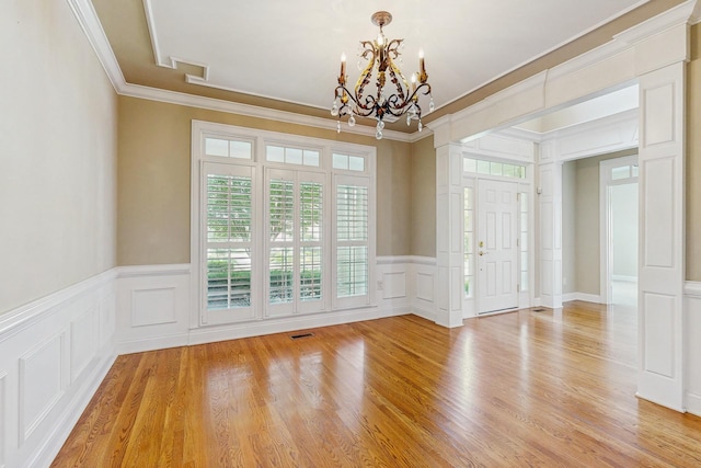 915 Joel Cheek Blvd, Franklin, TN 37064 - unfurnished room featuring a decorative wall, a chandelier, crown molding, healthy amount of natural light, and a wainscoted wall