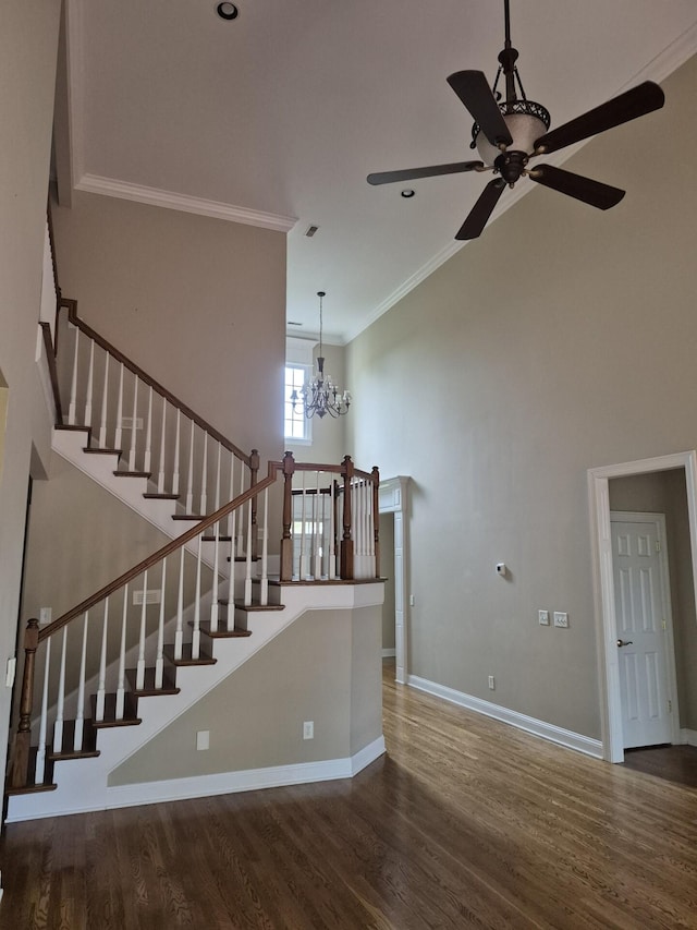 915 Joel Cheek Blvd, Franklin, TN 37064 - staircase with a ceiling fan, ornamental molding, a chandelier, a high ceiling, and wood finished floors