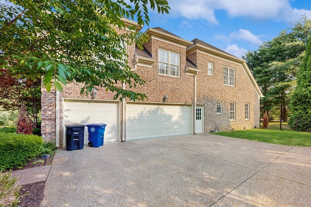 915 Joel Cheek Blvd, Franklin, TN 37064 - view of side of home featuring brick siding, concrete driveway, and an attached garage