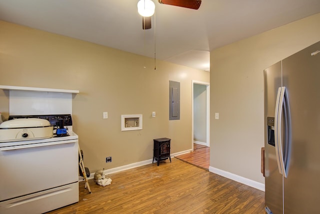 1609 E 26th St, Chattanooga, TN 37407 - washroom featuring electric panel, wood finished floors, a wood stove, and a ceiling fan