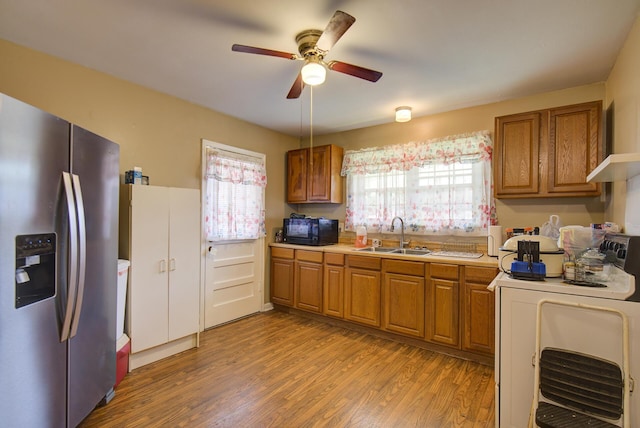 1609 E 26th St, Chattanooga, TN 37407 - kitchen featuring stainless steel fridge with ice dispenser, black microwave, washer / dryer, and brown cabinetry