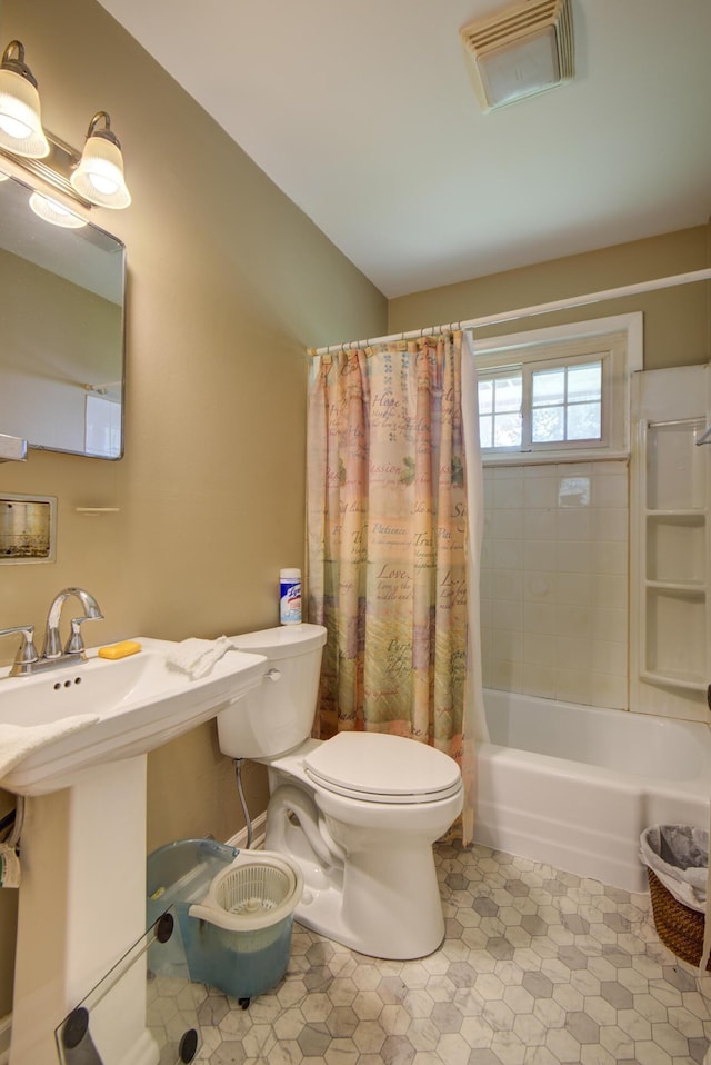 1609 E 26th St, Chattanooga, TN 37407 - bathroom with shower / tub combo with curtain and tile patterned flooring