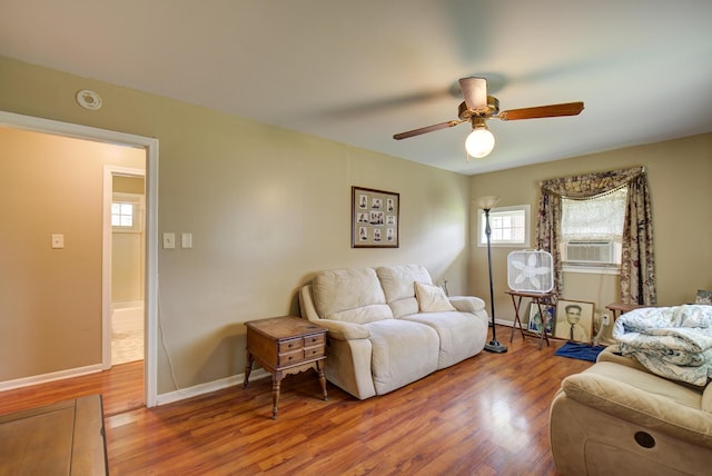 1609 E 26th St, Chattanooga, TN 37407 - living area featuring wood finished floors, cooling unit, and ceiling fan
