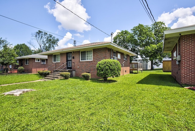 1609 E 26th St, Chattanooga, TN 37407 - view of front of home with brick siding and a front yard