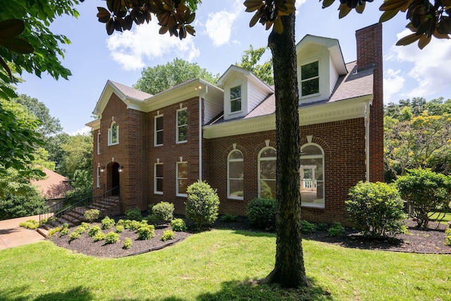 159 N Berwick Ln, Franklin, TN 37069 - view of front of property with brick siding, a chimney, a front lawn, and stairway