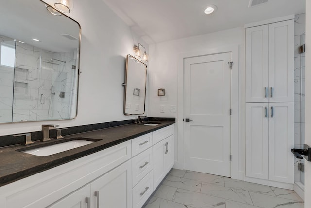 300 Natchez St, Franklin, TN 37064 - bathroom featuring marble look tiles, a marble finish shower, double vanity, and recessed lighting