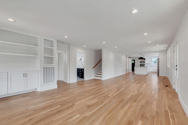 300 Natchez St, Franklin, TN 37064 - unfurnished living room with stairway, light wood-style flooring, recessed lighting, and built in features