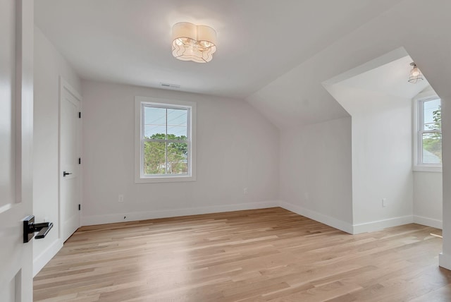 300 Natchez St, Franklin, TN 37064 - additional living space featuring healthy amount of natural light, light wood finished floors, and vaulted ceiling