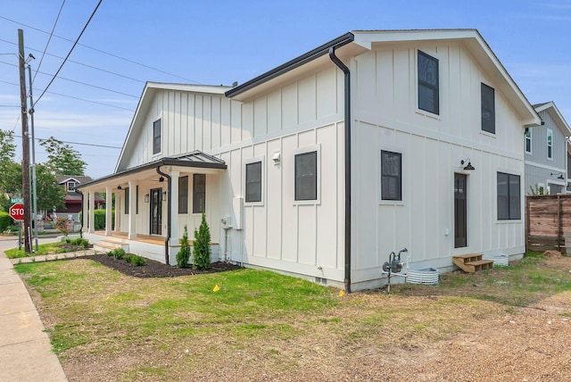 300 Natchez St, Franklin, TN 37064 - view of side of home with board and batten siding, a porch, and entry steps