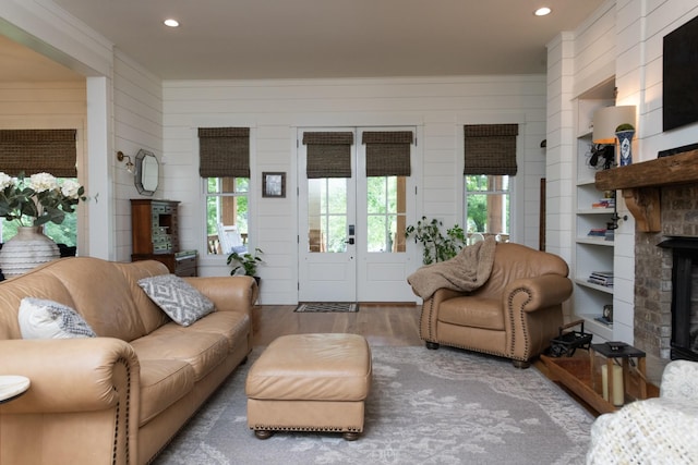 4150 Knipfer Rd, Joelton, TN 37080 - living room featuring wood finished floors, healthy amount of natural light, a brick fireplace, crown molding, and recessed lighting