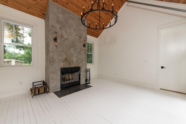 4150 Knipfer Rd, Joelton, TN 37080 - unfurnished living room featuring wood ceiling, vaulted ceiling, a chandelier, a fireplace, and wood finished floors