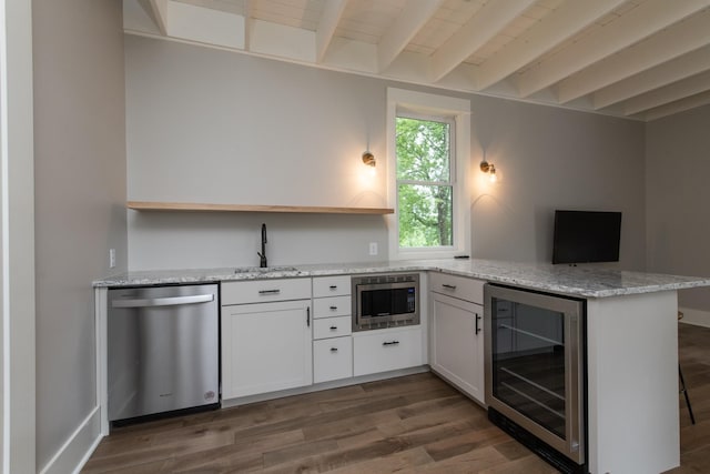 4150 Knipfer Rd, Joelton, TN 37080 - kitchen with appliances with stainless steel finishes, wine cooler, a peninsula, beam ceiling, and dark wood-style flooring