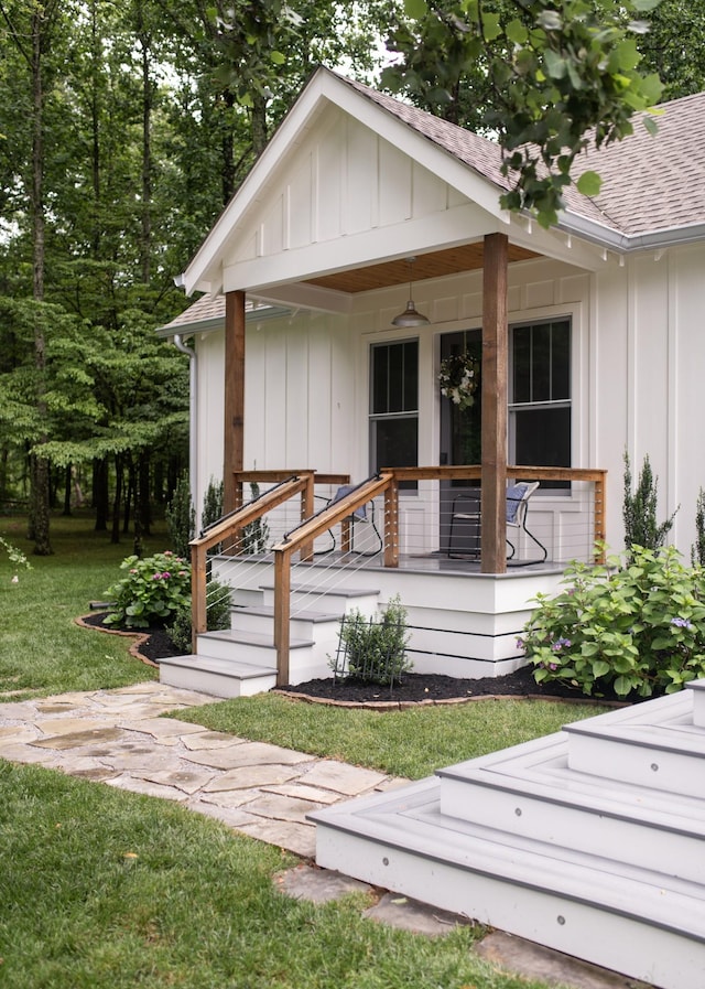 4150 Knipfer Rd, Joelton, TN 37080 - doorway to property featuring a porch, board and batten siding, roof with shingles, and a yard