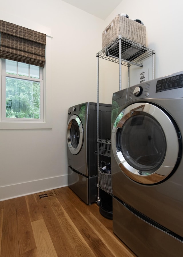 4150 Knipfer Rd, Joelton, TN 37080 - laundry room with washer and clothes dryer and wood finished floors