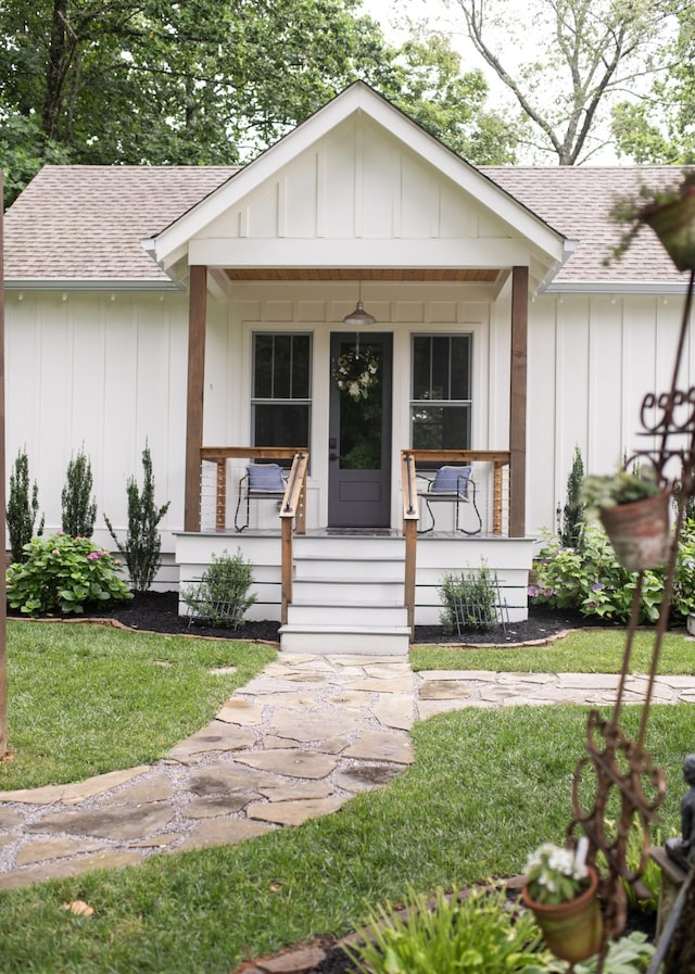 4150 Knipfer Rd, Joelton, TN 37080 - view of front facade with roof with shingles, a porch, and board and batten siding