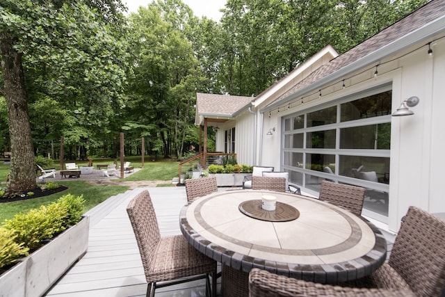 4150 Knipfer Rd, Joelton, TN 37080 - view of patio with outdoor dining area, a fire pit, and a deck