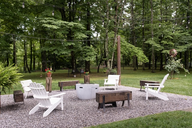 4150 Knipfer Rd, Joelton, TN 37080 - view of patio / terrace with view of scattered trees and a fire pit