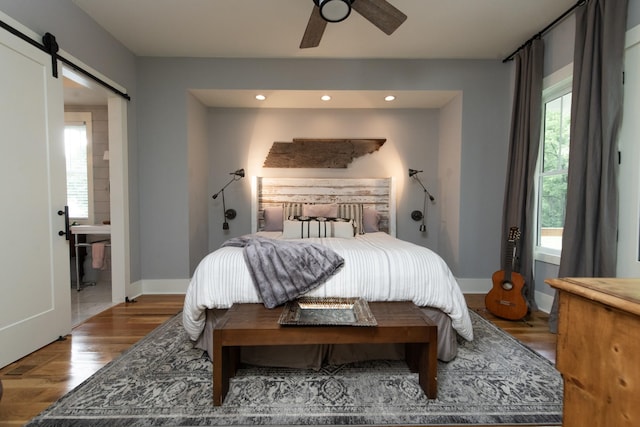 4150 Knipfer Rd, Joelton, TN 37080 - bedroom with recessed lighting, wood finished floors, and a barn door