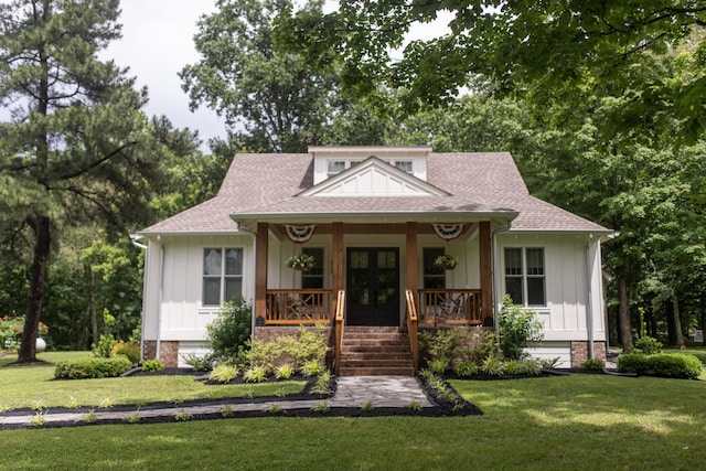 4150 Knipfer Rd, Joelton, TN 37080 - bungalow featuring board and batten siding, covered porch, and a front lawn