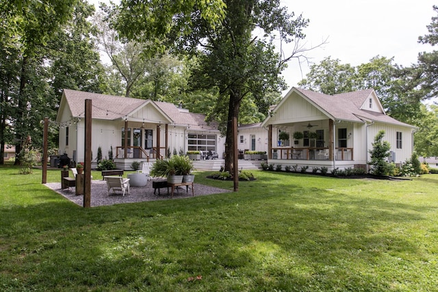 4150 Knipfer Rd, Joelton, TN 37080 - back of property with ceiling fan, a lawn, board and batten siding, a patio, and roof with shingles
