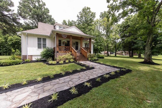 4150 Knipfer Rd, Joelton, TN 37080 - bungalow-style home featuring board and batten siding, a porch, a front lawn, and roof with shingles