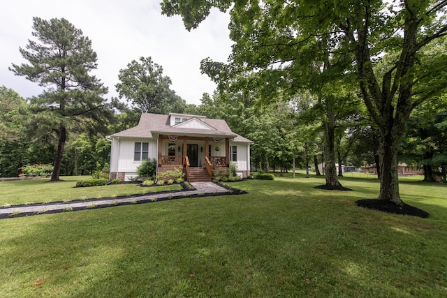 4150 Knipfer Rd, Joelton, TN 37080 - bungalow with covered porch, a front yard, board and batten siding, and view of scattered trees