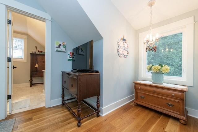 4150 Knipfer Rd, Joelton, TN 37080 - hall featuring vaulted ceiling, light wood-type flooring, and a chandelier