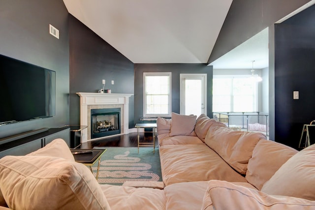 1029 Charles Thomas Dr, Clarksville, TN 37042 - living room featuring vaulted ceiling, a fireplace, and wood finished floors