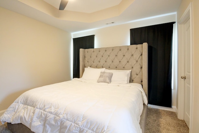 1029 Charles Thomas Dr, Clarksville, TN 37042 - carpeted bedroom with a ceiling fan and a raised ceiling
