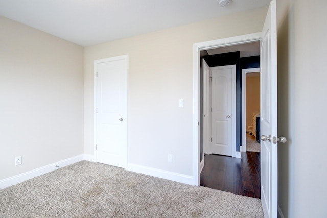 1029 Charles Thomas Dr, Clarksville, TN 37042 - unfurnished bedroom featuring dark carpet and baseboards