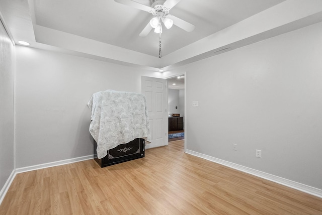1805 Needmore Rd, Clarksville, TN 37042 - empty room with light wood finished floors, recessed lighting, ceiling fan, and a tray ceiling