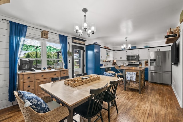 1805 Needmore Rd, Clarksville, TN 37042 - dining area featuring a chandelier and dark wood-type flooring