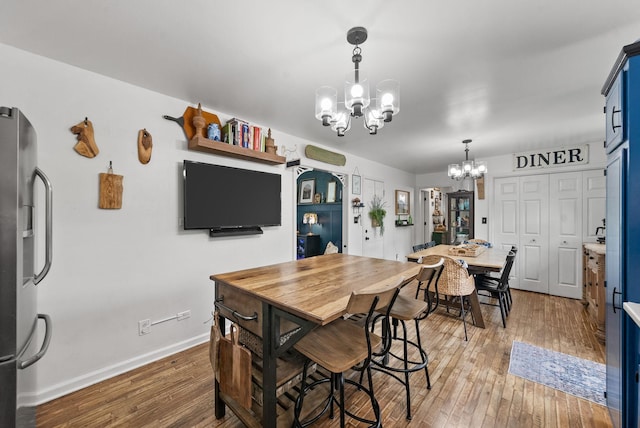 1805 Needmore Rd, Clarksville, TN 37042 - dining space with a chandelier and light wood-style flooring