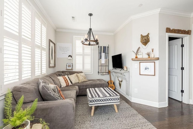 6067 Keats St, Franklin, TN 37064 - living room featuring a chandelier, dark wood-type flooring, healthy amount of natural light, and crown molding
