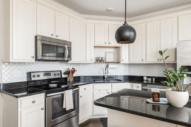 6067 Keats St, Franklin, TN 37064 - kitchen featuring stainless steel appliances, pendant lighting, tasteful backsplash, and white cabinets
