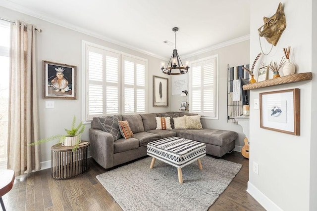 6067 Keats St, Franklin, TN 37064 - living room featuring a chandelier, ornamental molding, and wood finished floors
