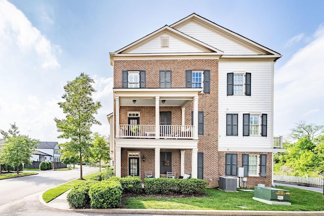 6067 Keats St, Franklin, TN 37064 - view of front facade with brick siding and a balcony