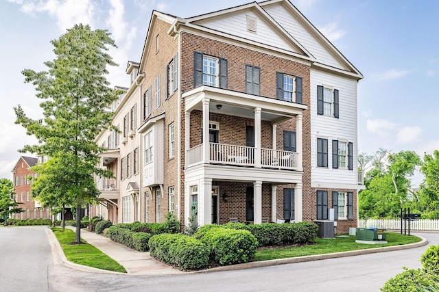 6067 Keats St, Franklin, TN 37064 - view of front of house with brick siding and a balcony
