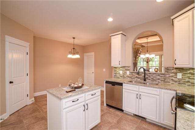 1789 Double R Blvd, Clarksville, TN 37042 - kitchen featuring stainless steel dishwasher, a chandelier, range, tasteful backsplash, and recessed lighting