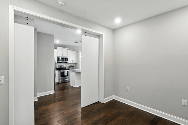 1000 Vintage Green Ln Unit 1201, Franklin, TN 37064 - unfurnished room with a smoke detector, dark wood-style flooring, and recessed lighting