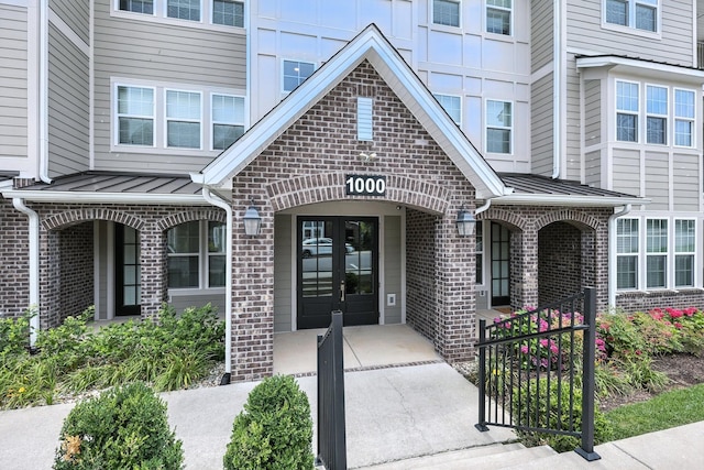1000 Vintage Green Ln Unit 1201, Franklin, TN 37064 - property entrance featuring brick siding, french doors, a standing seam roof, and a metal roof