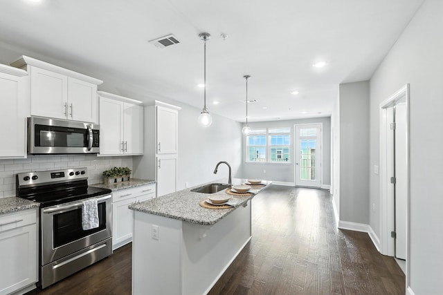 1000 Vintage Green Ln Unit 1201, Franklin, TN 37064 - kitchen featuring stainless steel appliances, decorative backsplash, light stone countertops, dark wood-type flooring, and recessed lighting