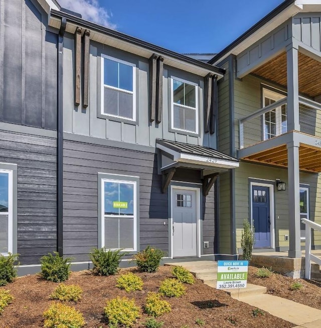 2429 E 17th St, Chattanooga, TN 37404 - view of front of property with board and batten siding and a balcony