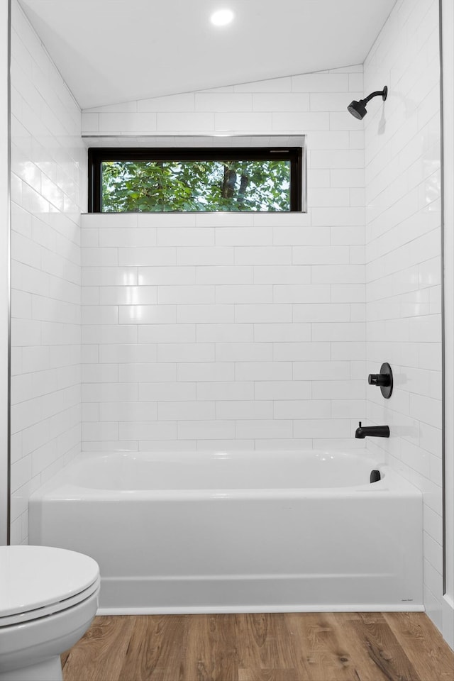 263 Eleanor Dr SW, Cleveland, TN 37311 - bathroom featuring shower / washtub combination, wood finished floors, and vaulted ceiling
