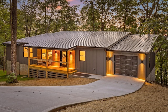 263 Eleanor Dr SW, Cleveland, TN 37311 - view of front of house with driveway, an attached garage, and a metal roof