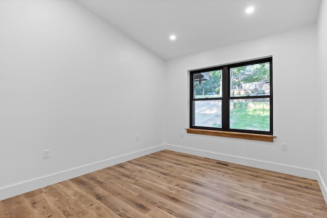 263 Eleanor Dr SW, Cleveland, TN 37311 - spare room with lofted ceiling, light wood-style flooring, and recessed lighting