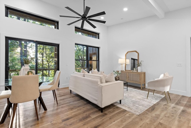 263 Eleanor Dr SW, Cleveland, TN 37311 - living room featuring light wood-style floors, a ceiling fan, beamed ceiling, recessed lighting, and a towering ceiling