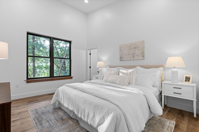 263 Eleanor Dr SW, Cleveland, TN 37311 - bedroom featuring wood finished floors, a towering ceiling, and recessed lighting