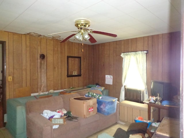 2625 Old Blacktop Rd, Mc Ewen, TN 37101 - living room featuring a ceiling fan and wood walls
