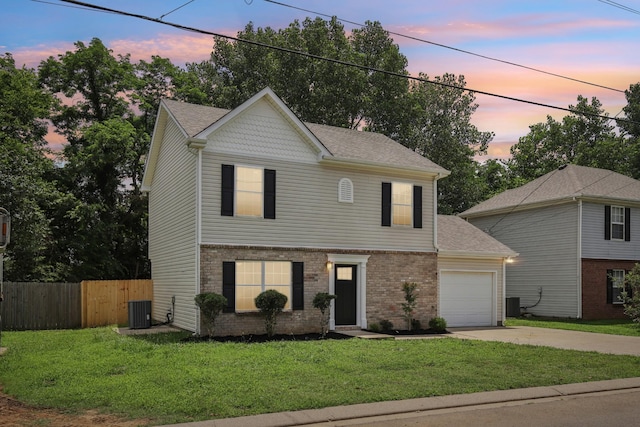 1033 Tom Hailey Blvd, La Vergne, TN 37086 - view of front of house with driveway, a garage, roof with shingles, and brick siding